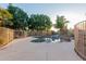 Private backyard pool with custom rock features surrounded by a patio area perfect for entertaining and relaxation at 5345 E Mclellan Rd # 83, Mesa, AZ 85205