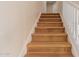 Staircase with wooden steps and white railing, providing a classic and functional design element to the home at 5345 E Mclellan Rd # 83, Mesa, AZ 85205