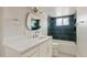 Bathroom featuring new vanity, mirror, and stylish dark green tile at 5927 E Edgemont Ave, Scottsdale, AZ 85257