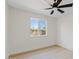 Bright bedroom featuring a ceiling fan, natural light, and wood floors at 5927 E Edgemont Ave, Scottsdale, AZ 85257