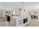 Stylish kitchen island with a microwave and dining area, perfect for entertaining at 5927 E Edgemont Ave, Scottsdale, AZ 85257