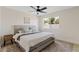 Comfortable bedroom with modern decor, a large window, and cozy furnishings at 5927 E Edgemont Ave, Scottsdale, AZ 85257