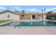 Inviting pool with well-maintained deck and covered patio, perfect for outdoor relaxation and entertaining at 5927 E Edgemont Ave, Scottsdale, AZ 85257