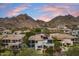 Beautiful aerial view of a suburban house with a pool and mountain views in the background at 6508 N 28Th St, Phoenix, AZ 85016