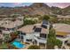 Stunning backyard with a pool and solar panels set against a beautiful mountain backdrop at 6508 N 28Th St, Phoenix, AZ 85016