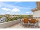 Outdoor balcony with wooden table and chairs, offering great views of the surrounding area at 6508 N 28Th St, Phoenix, AZ 85016