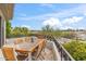 Outdoor balcony with wooden table and chairs offers picturesque views of the surrounding landscape at 6508 N 28Th St, Phoenix, AZ 85016