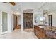 Luxurious bathroom features a glass shower, marble countertop, and double vanity sinks at 6508 N 28Th St, Phoenix, AZ 85016