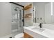 Modern bathroom boasts a glass-enclosed shower, floating shelves, and a sleek vanity at 6508 N 28Th St, Phoenix, AZ 85016