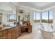 Well-lit bathroom with tub, vanity, and large windows offering nice views at 6508 N 28Th St, Phoenix, AZ 85016