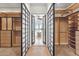 Walk-in closet leading to Primary bath with soaker tub in front of bay windows at 6508 N 28Th St, Phoenix, AZ 85016