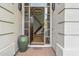 Inviting entryway featuring a grand chandelier, staircase, and a decorative urn, creating an elegant first impression at 6508 N 28Th St, Phoenix, AZ 85016