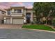 Stunning two-story home with a three car garage, lush landscaping, and a beautiful arched entry way at 6508 N 28Th St, Phoenix, AZ 85016