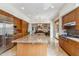 Open concept kitchen with granite island, stainless steel appliances, and custom cabinetry at 6508 N 28Th St, Phoenix, AZ 85016