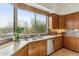 Well-lit kitchen with granite countertops, stainless steel appliances, and bright view at 6508 N 28Th St, Phoenix, AZ 85016