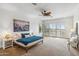 Bright main bedroom with plantation shutters allowing ample natural light, ceiling fan, and neutral decor at 6508 N 28Th St, Phoenix, AZ 85016