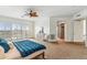 Bright, spacious main bedroom featuring neutral decor, shuttered windows, and a ceiling fan for added comfort at 6508 N 28Th St, Phoenix, AZ 85016