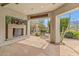 Charming outdoor patio featuring flagstone and desert landscaping with an outdoor fireplace at 6508 N 28Th St, Phoenix, AZ 85016