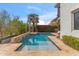 Inviting pool area featuring stone accents, lush landscaping, and a tranquil setting for relaxation and outdoor enjoyment at 6508 N 28Th St, Phoenix, AZ 85016