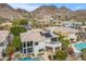 View of home with a covered balcony, mountain views and swimming pool at 6508 N 28Th St, Phoenix, AZ 85016