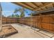 The backyard features a covered patio and a wood fence at 6711 W Osborn Rd # 127, Phoenix, AZ 85033