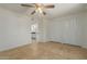 Bright bedroom featuring tan tile and closet storage space at 6711 W Osborn Rd # 127, Phoenix, AZ 85033