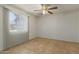 Well-lit bedroom featuring a ceiling fan and tile flooring at 6711 W Osborn Rd # 127, Phoenix, AZ 85033