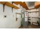 Utility room features a hot water heater and shelving at 6711 W Osborn Rd # 127, Phoenix, AZ 85033