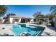 The private backyard features a pool, outdoor kitchen, covered patio, and desert landscaping at 737 E Boston St, Gilbert, AZ 85295