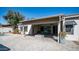 Enjoy outdoor living on this covered patio, with a dining area, fire pit, and desert landscaping at 737 E Boston St, Gilbert, AZ 85295