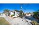 This home exterior features a xeriscaped yard, modern shuttered windows, and a paved walkway at 737 E Boston St, Gilbert, AZ 85295