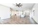 Expansive living room showcasing modern tile flooring, a large island with seating, and seamless transitions to the kitchen at 737 E Boston St, Gilbert, AZ 85295