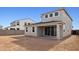 View of the backyard featuring a covered patio and sliding glass doors at 7400 W Quail Track Dr, Peoria, AZ 85383