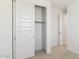 Bedroom featuring closet with sliding doors and neutral carpet at 7400 W Quail Track Dr, Peoria, AZ 85383