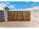 Backyard view of a metal and wood gate at 76 N 133Rd St, Chandler, AZ 85225