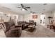 Expansive living room featuring neutral paint and carpet with ceiling fans and views of the entire house at 76 N 133Rd St, Chandler, AZ 85225