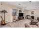 Spacious living room featuring plush seating, neutral walls, and a ceiling fan for added comfort at 76 N 133Rd St, Chandler, AZ 85225