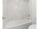 Bright bathroom features a modern tub with marble surround and stylish fixtures at 7987 W Griswold Rd, Peoria, AZ 85345