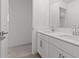 Bright bathroom with double sinks, white cabinets, and stylish fixtures, offering plenty of counter space at 7987 W Griswold Rd, Peoria, AZ 85345