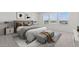 This primary bedroom offers great natural light and features decor to give the room an inviting, homey feel at 7987 W Griswold Rd, Peoria, AZ 85345