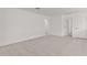 Neutral bedroom with plush carpeting, white walls, and multiple doorways at 7987 W Griswold Rd, Peoria, AZ 85345