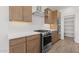 Well-equipped kitchen with a stainless steel oven and range, ample cabinet space, and quartz countertops at 7987 W Griswold Rd, Peoria, AZ 85345