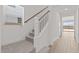 Carpeted staircase with white banister and wood railing, leading to the upper level at 7987 W Griswold Rd, Peoria, AZ 85345