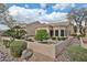 A meticulously landscaped backyard features desert plants, a privacy wall, and a serene outdoor setting at 8347 W Taro Ln, Peoria, AZ 85382