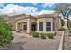 View of a house with a covered patio, stone flooring and low maintenance desert landscaping at 8347 W Taro Ln, Peoria, AZ 85382