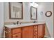 Bathroom vanity with double sinks, granite countertop, and custom cabinetry at 8347 W Taro Ln, Peoria, AZ 85382