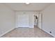 A bedroom featuring tile floors and a closet with folding doors at 8347 W Taro Ln, Peoria, AZ 85382