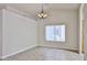 Well-lit dining space featuring tile flooring, a chandelier, and a large window at 8347 W Taro Ln, Peoria, AZ 85382