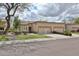 Charming single-story home with a two-car garage, beautiful landscaping, and neutral color palette at 8347 W Taro Ln, Peoria, AZ 85382