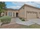 Welcoming one-story home with a two-car garage, tidy landscaping, and a paved walkway at 8347 W Taro Ln, Peoria, AZ 85382